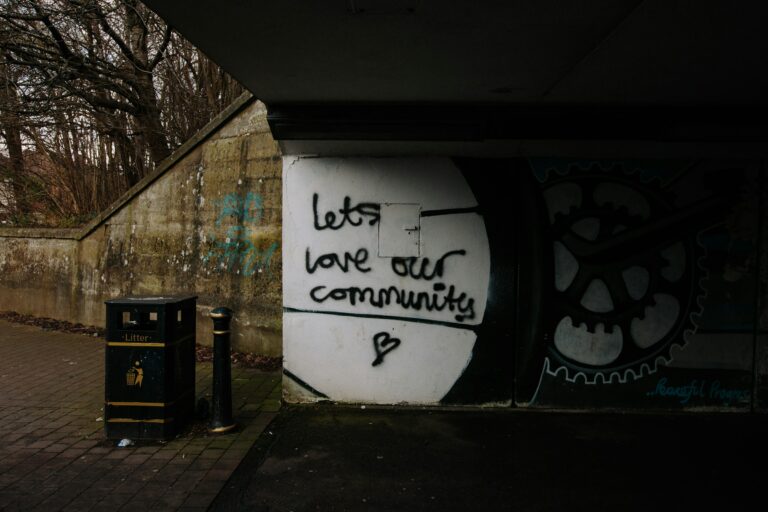 Graffiti on a wall in Cardiff that says lets love our community. By Mike Erskine